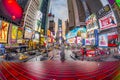 Neon advertising of News, brands and theaters at times square in early morning at sunrise