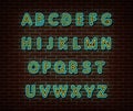 Neon alphabet type font vector isolated on brick wall. ABC typography letters light symbol, decoration text effect. Neon alphabet Royalty Free Stock Photo