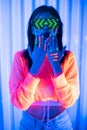 Neon  asian woman dancing. Fashion model woman in neon light, portrait of beautiful model with fluorescent make-up, Art and future Royalty Free Stock Photo