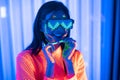 Neon  asian woman dancing. Fashion model woman in neon light, portrait of beautiful model with fluorescent make-up, Art and future Royalty Free Stock Photo