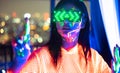 Neon  asian woman dancing. Fashion model woman in neon light, portrait of beautiful model with fluorescent make-up, Art and future Royalty Free Stock Photo