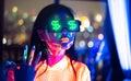 Neon  asian woman dancing. Fashion model woman in neon light, portrait of beautiful model with fluorescent make-up, Art and future Royalty Free Stock Photo