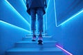 Neon background: Dark blue stairs with neon shoes. Night club, bar concert, generative ai image Royalty Free Stock Photo