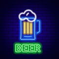 Neon beer sign on brick wall background.