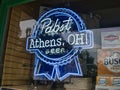 Neon Beer sign in window in Athens Ohio USA