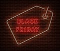 Neon Black Friday price banner vector isolated on brick wall. Special price offer light symbol, decoration text effect. Neon black Royalty Free Stock Photo