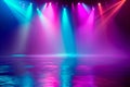 Neon blue and pink spotlights illuminate empty textured stage floor