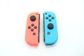 A neon blue and neon red Nintendo Switch joycon Royalty Free Stock Photo
