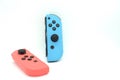 A neon blue and neon red Nintendo Switch joycon Royalty Free Stock Photo