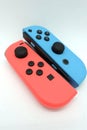 A neon blue and neon red Nintendo Switch joycon