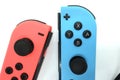 A neon blue and neon red Nintendo Switch joycon Royalty Free Stock Photo