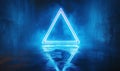 Neon blue triangle glowing in dark corridor with reflective floor and fog effects Royalty Free Stock Photo