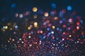 Neon bokeh background with blue, yellow and pink colors on dark. Blur halftone glitter texture. Blurred night lights glow