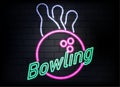 Neon bowling sign on brick wall background