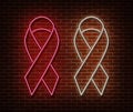 Neon breast cancer awareness signs on brick wall. Pink ribbon light symbol, led effect. Neon illustration