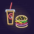 Neon burger and cola. Night illuminated wall street sign. Isolated geometric style illustration on brick wall background.
