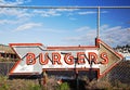 Neon burger sign in sign scrapyard Royalty Free Stock Photo