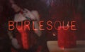 Neon Burlesque Sign in Rainy Wet Window Royalty Free Stock Photo