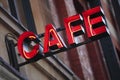 Neon cafe sign, restaurant building, night Royalty Free Stock Photo