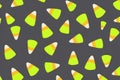 Neon Candy Corn Pattern on Dark Background for Festive Autumn Designs. Royalty Free Stock Photo