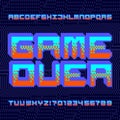 Game Over alphabet font. 3D effect pixel letters, numbers and symbols. Dark pixel background. Royalty Free Stock Photo
