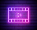 Neon cinema film in purple and violet color. Vector illustration of cinema film with Play icon consisting of neon