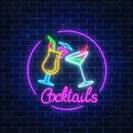 Neon cocktails bar sign in circle frame with lettering on dark brick wall background. Glowing gas advertising Royalty Free Stock Photo