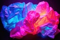 neon colored crumpled paper under uv light