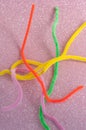 Neon colored pipe cleaners isolated on white background.