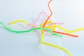 Neon colored pipe cleaners isolated on white background.