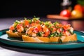 neon colored plate with freshly made shrimp bruschetta