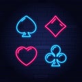 Neon colored symbols deck of cards for playing poker and casino on black background.