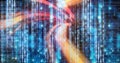 Neon colourful light trails over computer code, program coding and technology concept Royalty Free Stock Photo