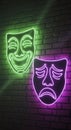 Neon Comedy Tragedy Masks on Brick Wall Royalty Free Stock Photo