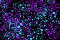 Neon cyan and purple random round paint splashes on black background. Abstract colorful texture