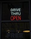 Neon Drive Thru Open Sign in Restaurant Window Royalty Free Stock Photo