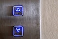 Neon elevator controls, up, down, close up
