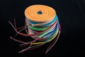 Neon flexible strip light. Flexible led tape neon flex in different colors on black background Royalty Free Stock Photo
