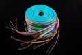 Neon flexible strip light. Flexible led tape neon flex in different colors on black background Royalty Free Stock Photo