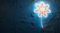 Neon flower glowing on a textured dark wall. Royalty Free Stock Photo