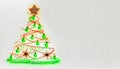 Neon glowing christmas tree with baubles and star at top on white background with copy space Royalty Free Stock Photo