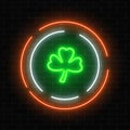 Neon glowing clover leaf sign. Green shamrock as Irish national holiday symbol in circle frames. Royalty Free Stock Photo