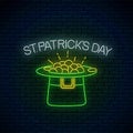 Neon glowing sign of leprechaun hat with gold. Green hat with treasure. Ireland national holiday symbol Royalty Free Stock Photo