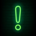 Neon green exclamation mark on dark brick wall. Cinema, show, theatre, circus, casino design. Intellectual sign. Laser