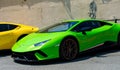 Neon green Lamborghini Performante parked on the street facing side ways.