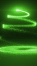 Neon green light trails forming a spiral Christmas tree shape on a dark glowing background Royalty Free Stock Photo