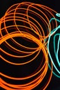 Neon green and red thin wire. Luminous wires, decoration and illumination of the surface. Electroluminescent wire, lighting object