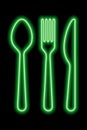 Neon green shapes of spoon, fork and table khife on a black background. Set of cutlery Royalty Free Stock Photo