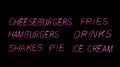 Neon Hamburger Diner Menu in Rainy Window Royalty Free Stock Photo