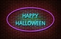 Neon Happy Halloween text signs isolated on brick wall. Night party text light symbol, decoration effect. Neon halloween